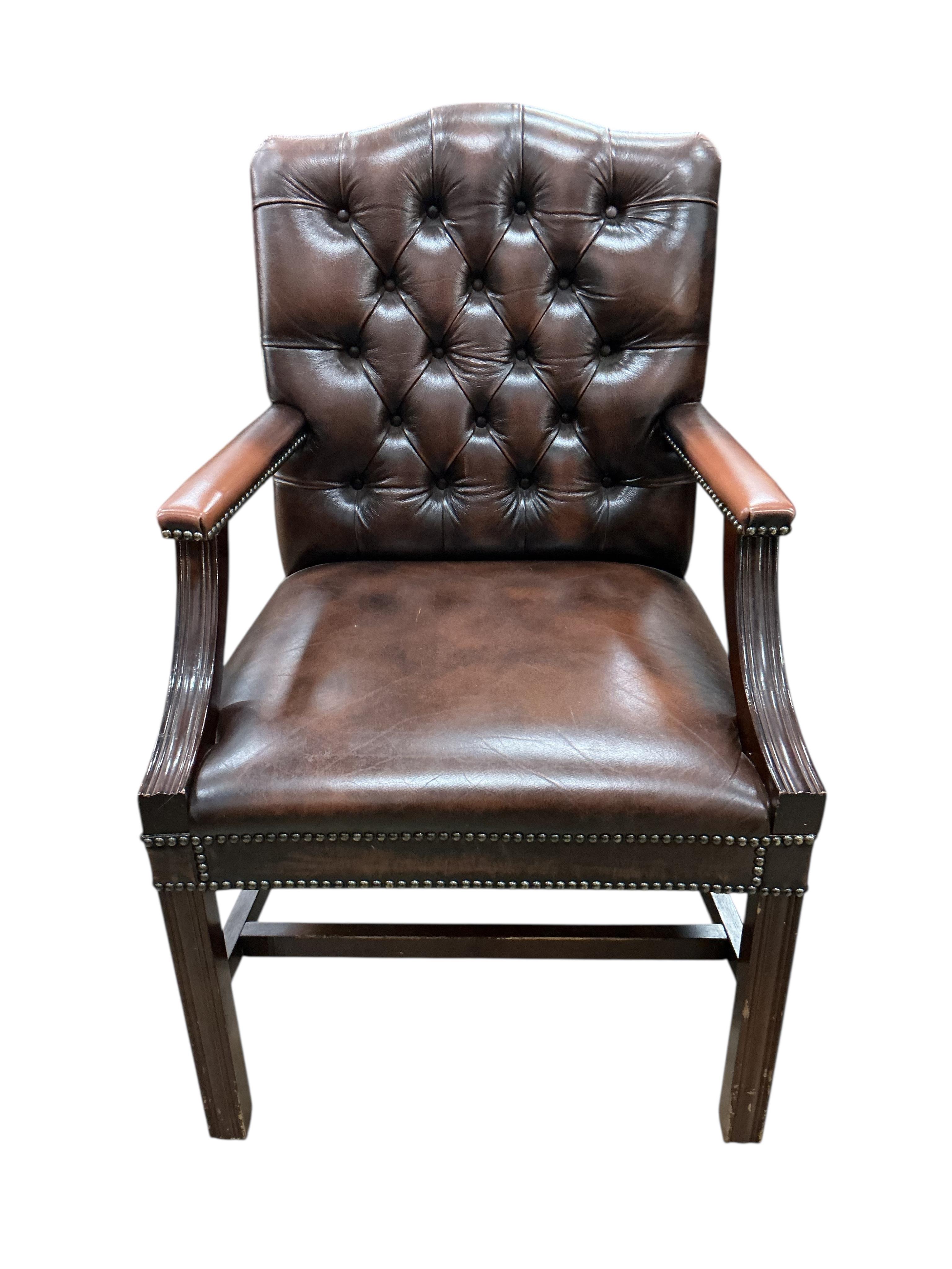 Three George III style button brown leather mahogany Gainsborough type chairs, width 62cm, depth 52cm, height 98cm